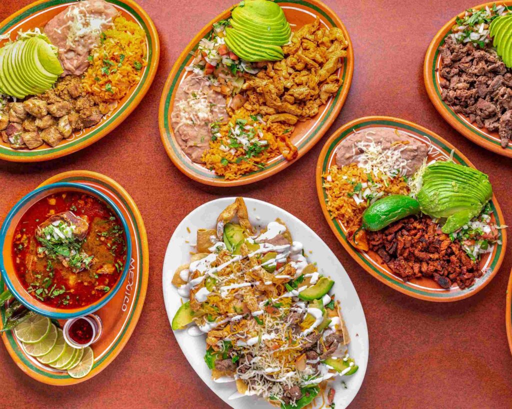 Algoberto's Taco Shop image in Yucca Valley, CA. Photo of food plates, tacos, veggies, rice, and more.