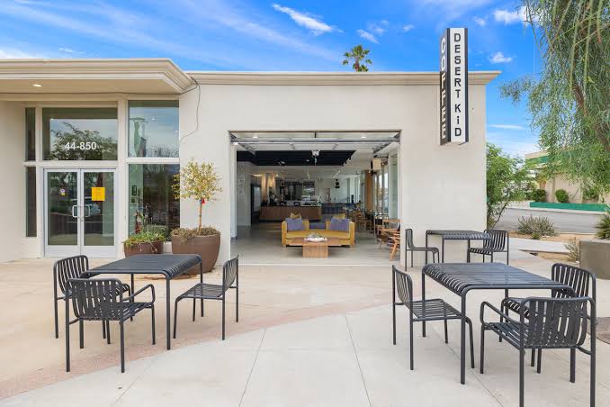 Desert Kid Coffee interior and exterior photo with cool roll up door.